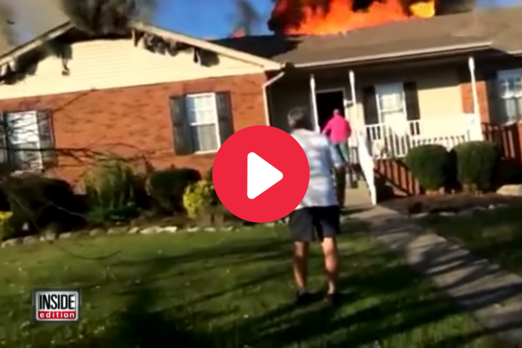 Video of an off-duty firefighter saving dog from house fire.